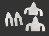 Four flat metal cut pieces with curved U-shaped slots
