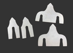 Four flat metal cut pieces with curved U-shaped slots
