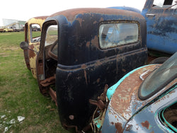 Rusted Black Chevy 3 Window Cab