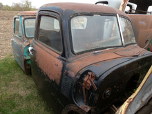 Rusted Black Chevy 3 Window Cab